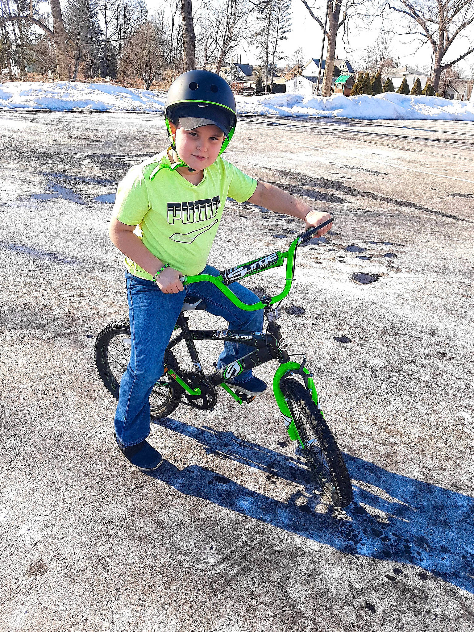 Hoyt is registered to the contest to win money with this photo: automotive_tire, bicycle, bicycle_accessory, bicycle_fork, bicycle_frame, bicycle_handlebar, bicycle_helmet, bicycle_part, bicycle_tire, bicycle_wheel, bicycles_equipment_and_supplies, crankset, headwear, helmet, outdoor_recreation, person, snow, sports_equipment, tire, tree