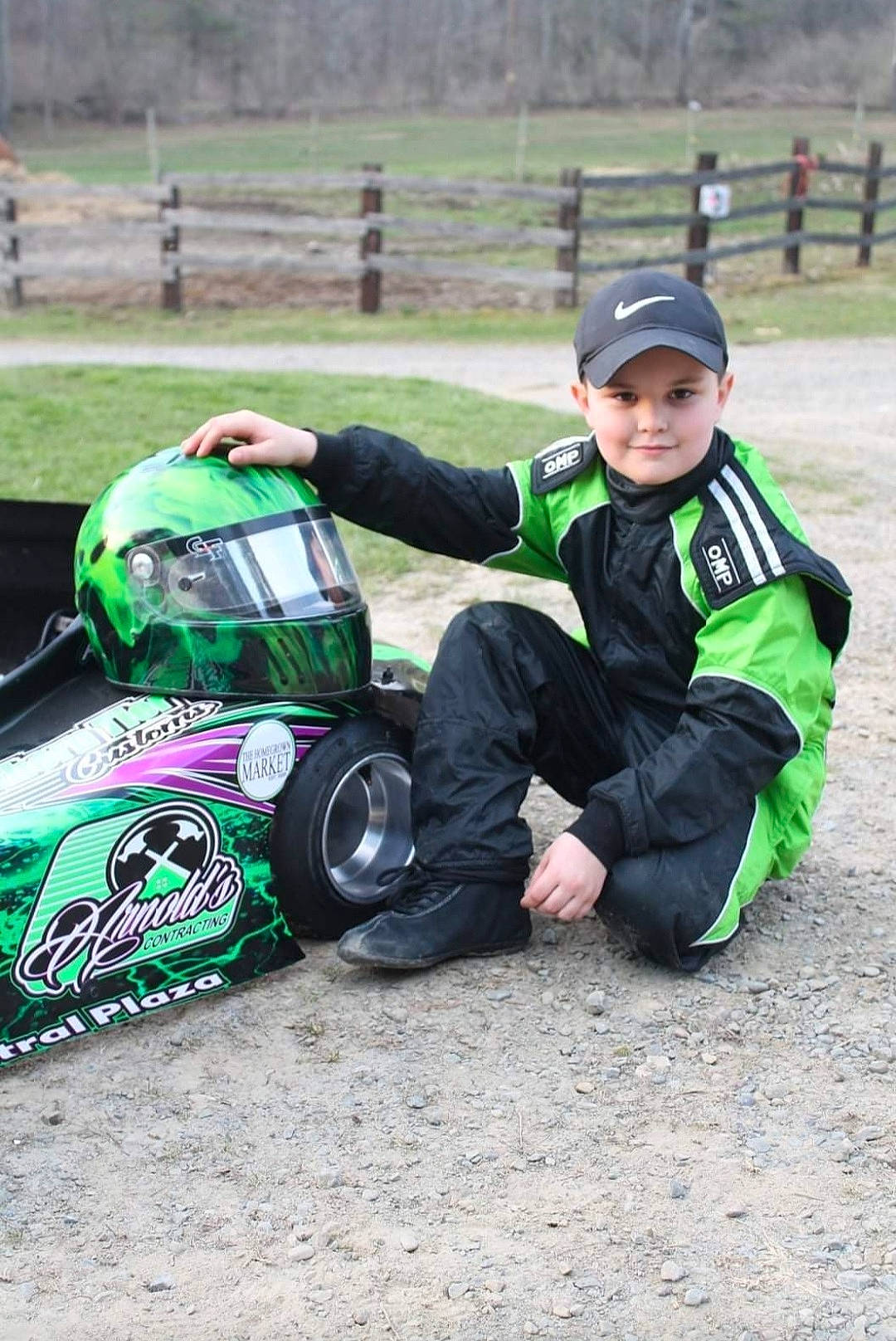 Hoyt joined the competition — help win amazing prizes! automotive_design, automotive_exterior, automotive_tire, automotive_wheel_system, car, competition_event, grass, hat, headgear, headwear, joy, land_vehicle, luggage_and_bags, motor_vehicle, motorsport, person, personal_protective_equipment, racing, recreation, tire