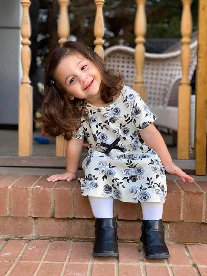 Carolina is registered to the contest to win money with this photo: beauty, boot, child, child_model, clothing, dress, footwear, joint, joy, knee, leg, pattern, person, photograph, photography, shoe, shoulder, smile, snapshot, thigh