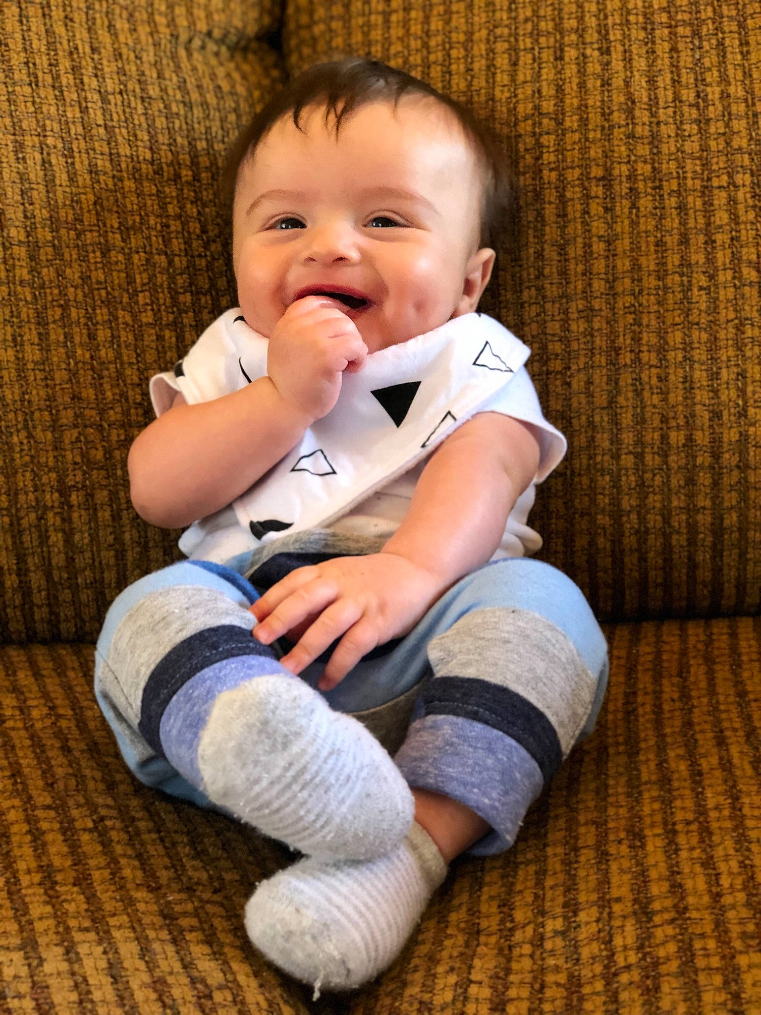 Grant is registered to the contest to win money with this photo: baby, baby_toddler_clothing, cheek, child, facial_expression, happy, laugh, leg, person, sitting, smile, toddler