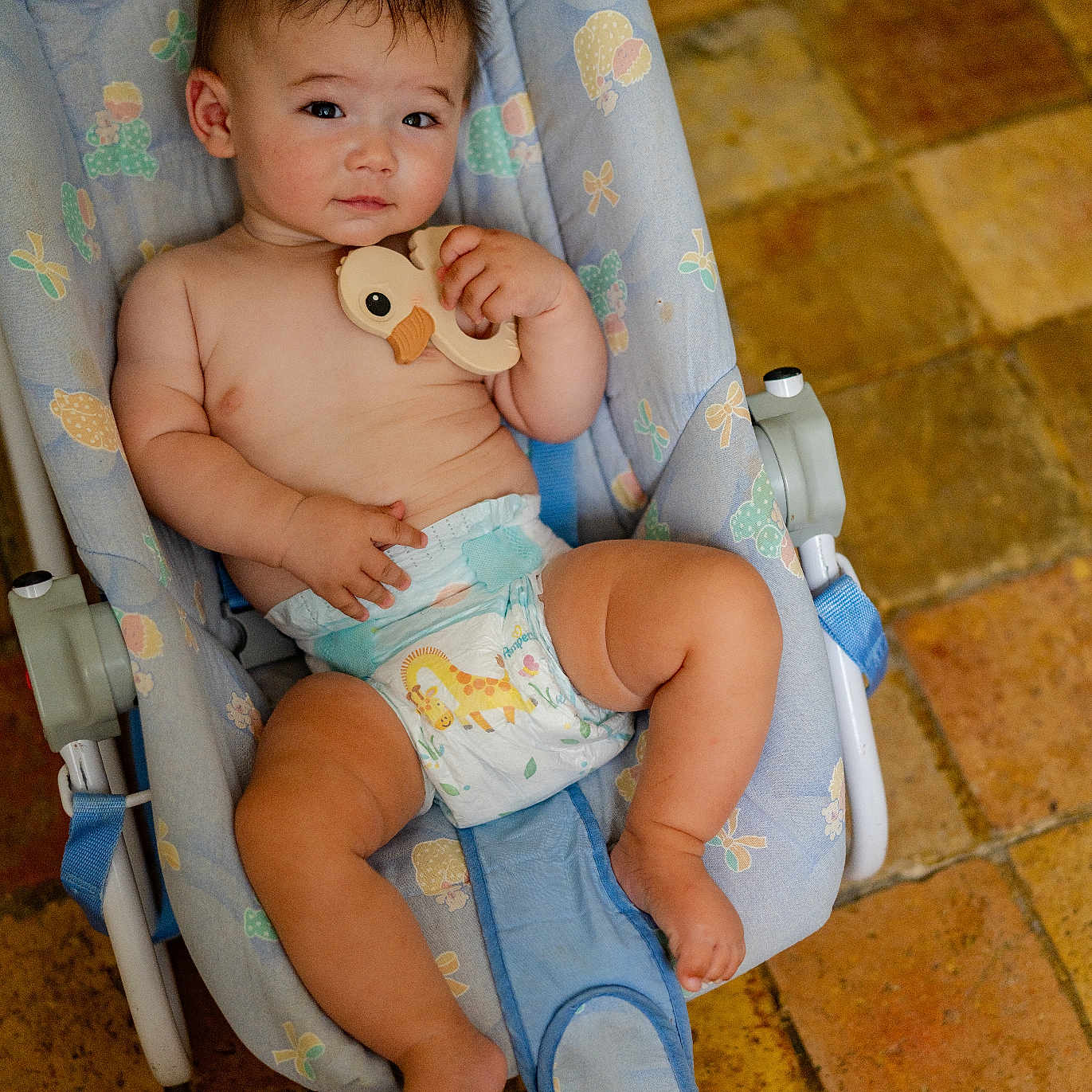 Charlie is registered to the contest to win money with this photo: accessories, baby, bed, bodypart, car, couch, cutlery, diaper, face, finger, furniture, hand, head, newborn, person, photography, portrait, sitting, spoon, strap