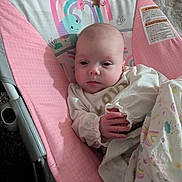 Everly joined the competition — help win amazing prizes! baby, infant, blanket, baby_rocker, pink, animal_print, monkey, elephant, sun, clothing, person, face, hand, indoor, soft_lighting, cute, child, resting, portrait, cozy