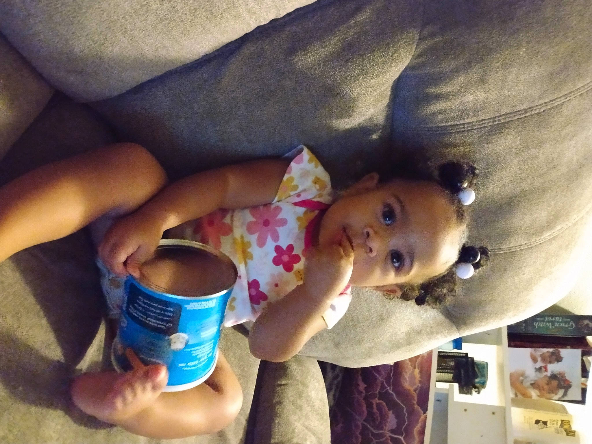 Leilani is registered to the contest to win money with this photo: child, coffee_cup, comfort, cool, cup, drink, drinkware, finger, food, hand, happy, mug, nail, person, serveware, t_shirt, tableware, textile, toddler, wrist