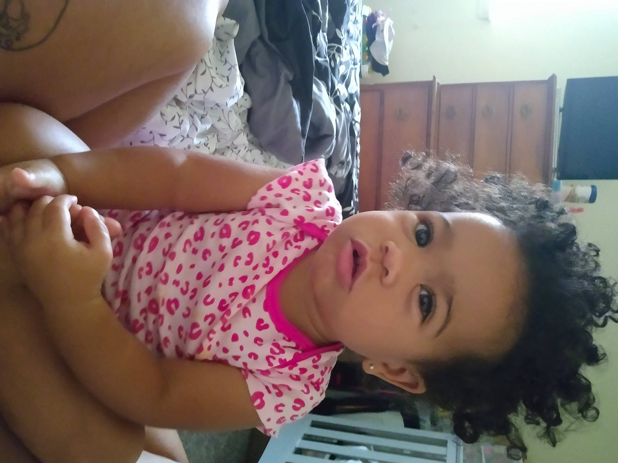 Leilani is registered to the contest to win money with this photo: arm, beauty, cheek, child, eyelash, facial_expression, gesture, happy, joint, leg, lip, mammal, mouth, nose, organ, person, skin, thigh, toddler, trunk