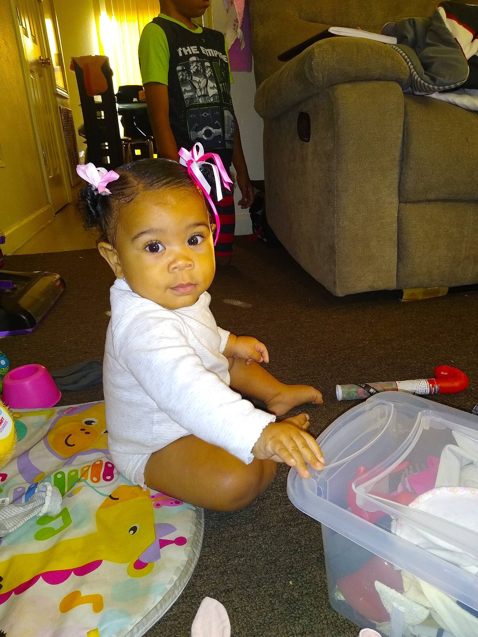 Leilani joined the competition — help win amazing prizes! bag, birthday, box, chair, child, comfort, event, flooring, fun, lap, luggage_and_bags, person, pink, plastic, play, product, room, sitting, t_shirt, table