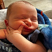 Jaxon joined the competition — help win amazing prizes! baby, sleeping, face, hand, blanket, clothing, infant, skin, cute, peaceful, newborn, cozy, soft, indoors, child, portrait, closeup, rest, comfort, expression