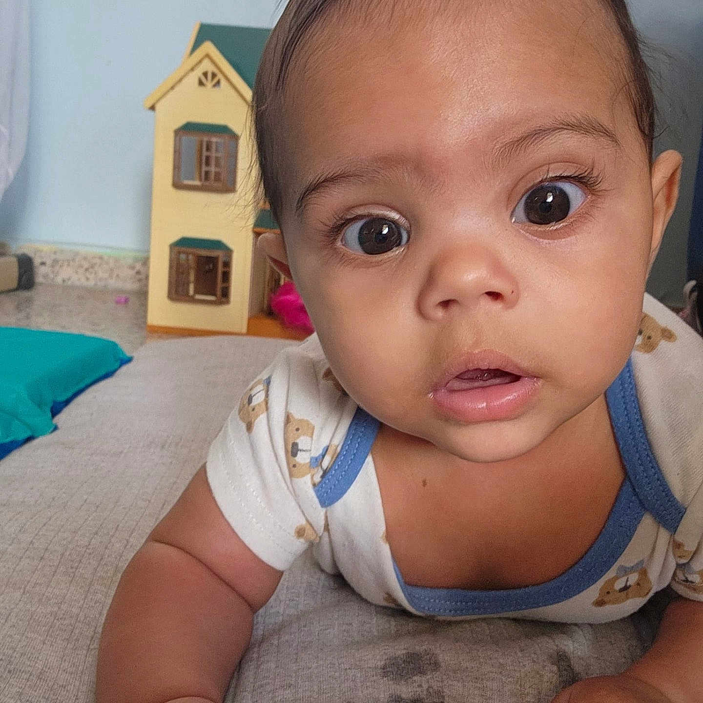 Matheo Isaias is registered to the contest to win money with this photo: baby, cheeks, closeup, curious, cute, expression, eyes, face, gaze, hands, indoor, infant, mattress, nose, onesie, photography, portrait, skin, toddler, toy_house