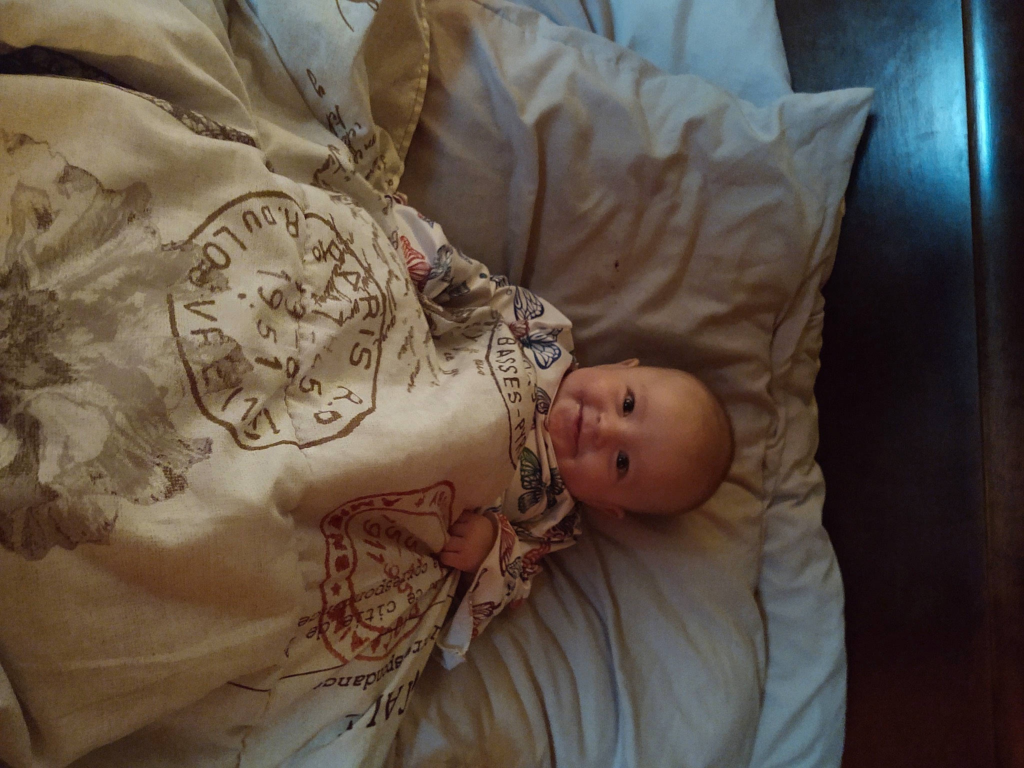 Dixie is registered to the contest to win money with this photo: abdomen, baby, baby_toddler_clothing, chest, comfort, eye, flesh, hand, head, human_body, jewellery, joy, linens, pattern, peach, person, room, sleeve, toddler, trunk