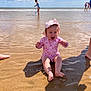 baby, child, beach, sand, water, ocean, swimsuit, hat, splashing, sunny, sky, clouds, play, happy, smiling, summer, vacation, people, shore, foot