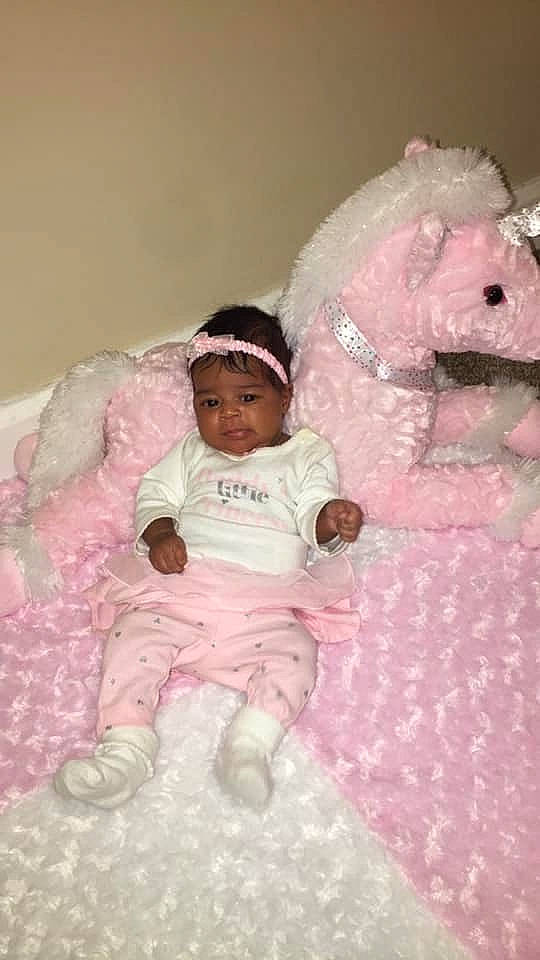 Ka'Lilah joined the competition — help win amazing prizes! baby, baby_products, baby_toddler_clothing, bed, bedtime, child, headwear, infant_bed, person, pink, product, room, skin, stuffed_toy, teddy_bear, textile, toddler, white