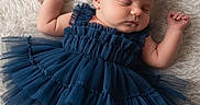 Scarlett is registered to the contest to win money with this photo: baby, sleeping, dress, blue, ruffles, infant, soft, fluffy, texture, peaceful, cute, child, portrait, laying, newborn, skin, hands, feet, closed_eyes, adorable