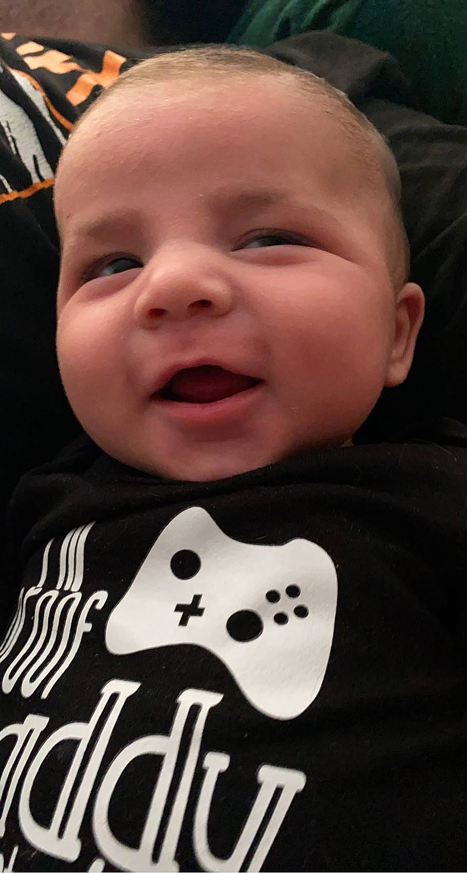 Lachlan is registered to the contest to win money with this photo: baby, baby_toddler_clothing, black, cheek, child, chin, eye, facial_expression, fun, happy, head, person, photograph, product, skin, sleeve, smile, snapshot, toddler, vertebrate