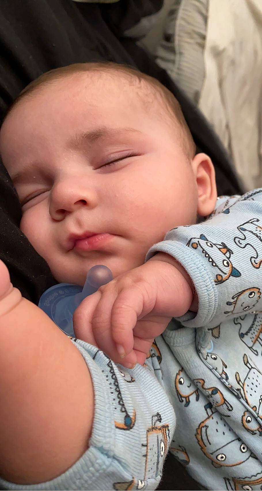 Lachlan is registered to the contest to win money with this photo: baby, cheek, chin, comfort, eyebrow, eyelash, facial_expression, forehead, gesture, hairstyle, hand, human, lip, mammal, mouth, neck, nose, person, product, skin
