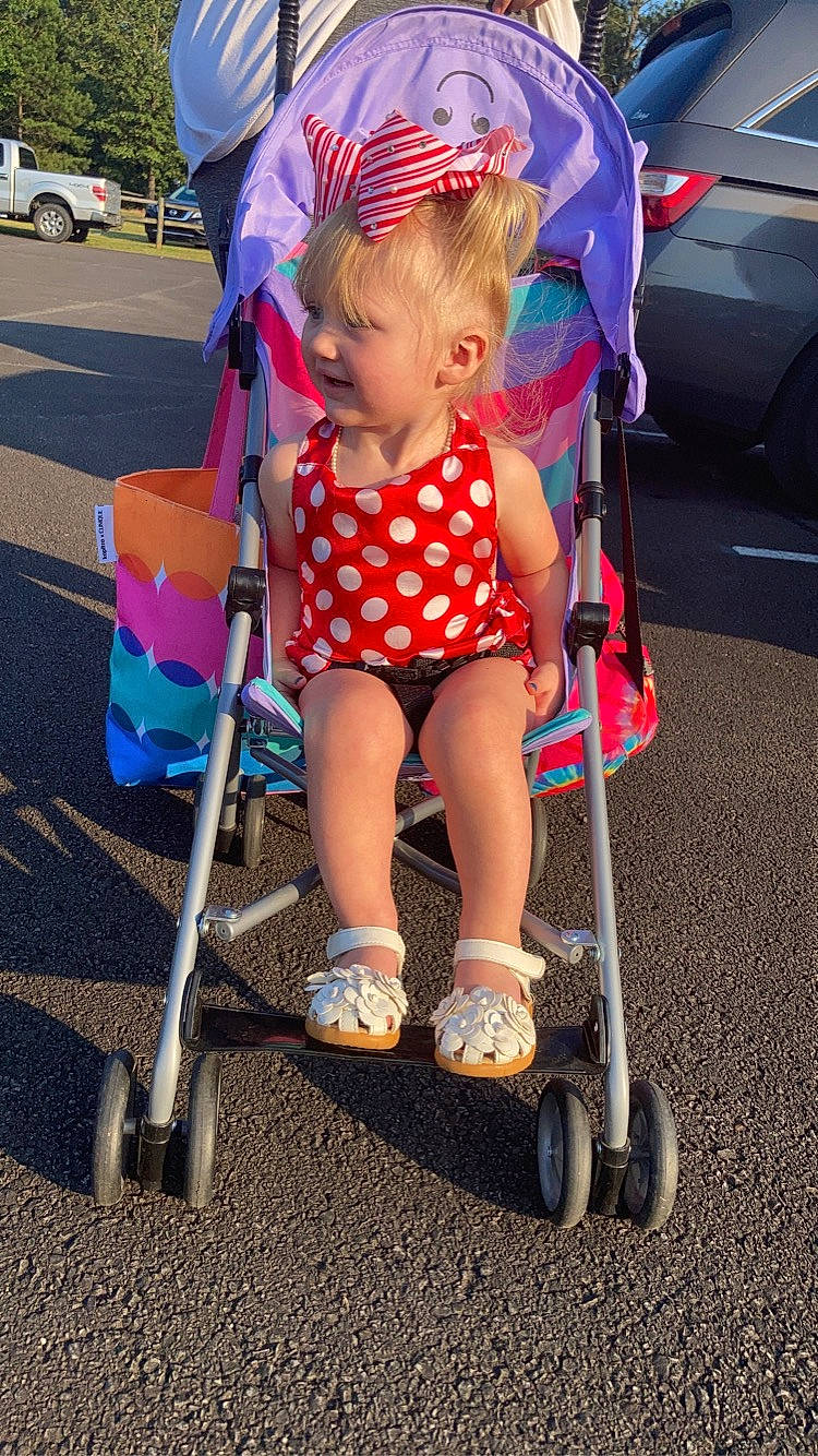 Jazelle joined the competition — help win amazing prizes! baby, baby_carriage, child, city, electric_blue, eyewear, fun, grass, leg, leisure, magenta, person, photograph, pink, product, recreation, shorts, snapshot, tire, toddler