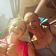 Olivia participe au concours pour gagner de l'argent avec cette photo : bus, casual_clothing, child, daytime, family, friendship, hair, happy, head_and_shoulders, indoor, necklace, people, portrait, selfie, skin, smile, sunlight, transport, window, woman