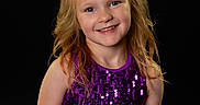Grayleigh joined the competition — help win amazing prizes! child, girl, smile, blonde_hair, bow, purple_dress, sequins, portrait, happy, tutu, dress, fashion, cute, studio, posing, young, person, background_black, sparkle, celebration