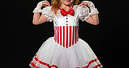 Grayleigh is registered to the contest to win money with this photo: ballet, black_background, child, costume, dance, dance_shoes, fashion, girl, gloves, performance, portrait, posing, red_and_white, red_bow, smiling, standing, studio, tutu, white_dress, young
