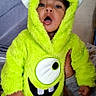 toddler, child, costume, green, monster, hood, cute, indoor, person, baby, fuzzy, clothing, face, expression, hand, holding, apparel, portrait, young, funny