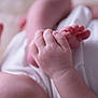 baby, hand, foot, infant, skin, closeup, soft, newborn, fingers, toes, white_clothing, delicate, cute, tender, small, human, child, pink, baby_skin, newborn_clothing