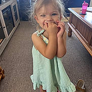 Echo joined the competition — help win amazing prizes! child, girl, toddler, portrait, smiling, happy, indoors, dress, green_dress, pink_shoes, sippy_cup, furniture, table, carpet, living_room, playful, blonde_hair, hair_bun, standing, family_photo