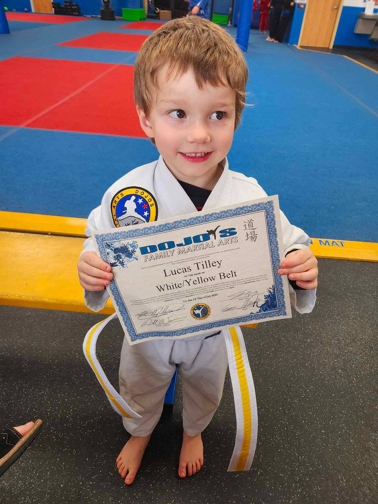 Lucas joined the competition — help win amazing prizes! chair, child, competition_event, electric_blue, event, flooring, fun, games, japanese_martial_arts, joy, karate, martial_arts_uniform, person, recreation, sleeve, smile, sports, sports_uniform, sportswear, t_shirt