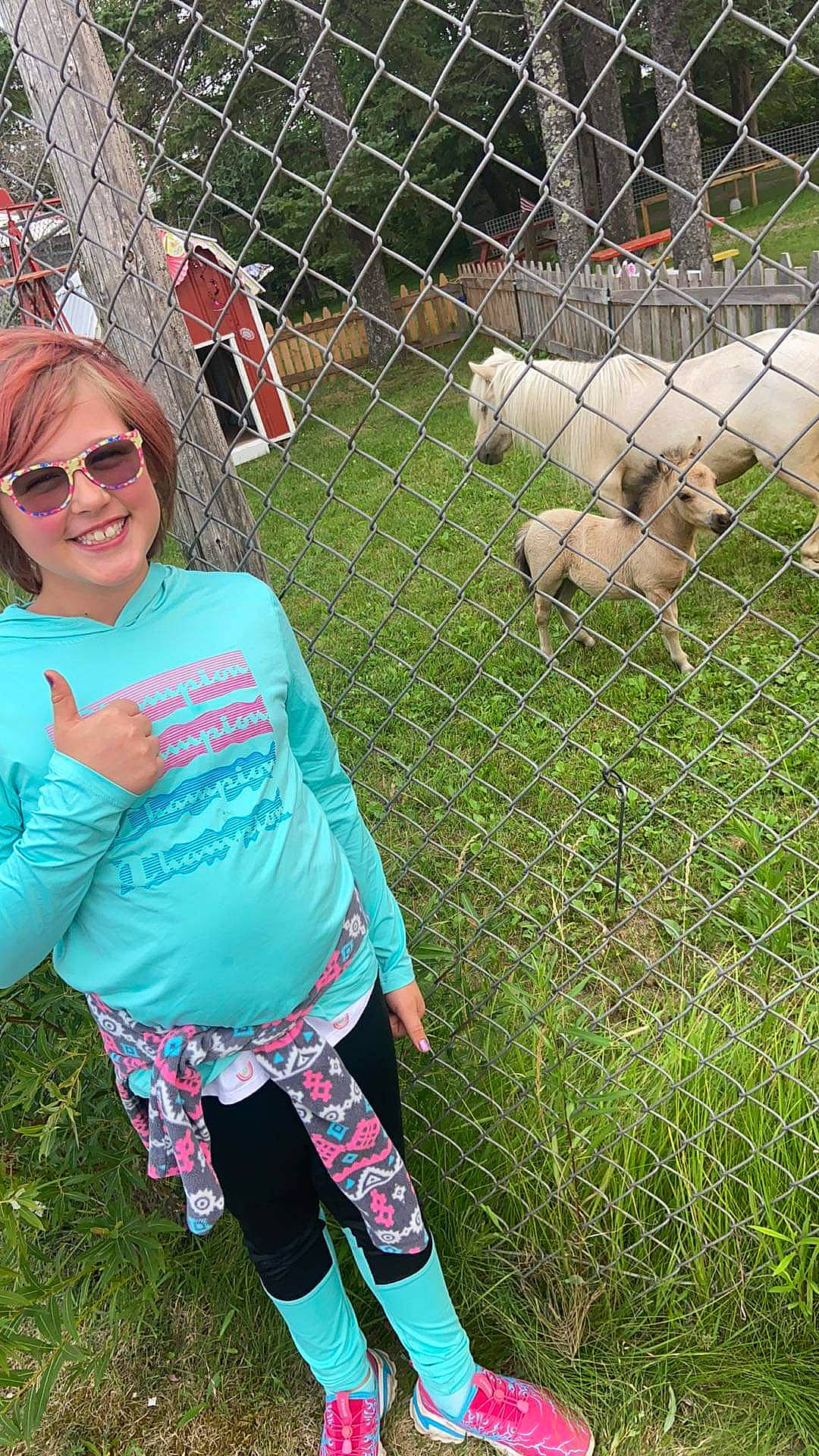 Danyelle joined the competition — help win amazing prizes! animal_shelter, carnivore, chain_link_fencing, companion_dog, dog_breed, eyewear, fence, goats, goggles, grass, joy, leisure, mesh, pasture, person, recreation, smile, sunglasses, t_shirt, toddler
