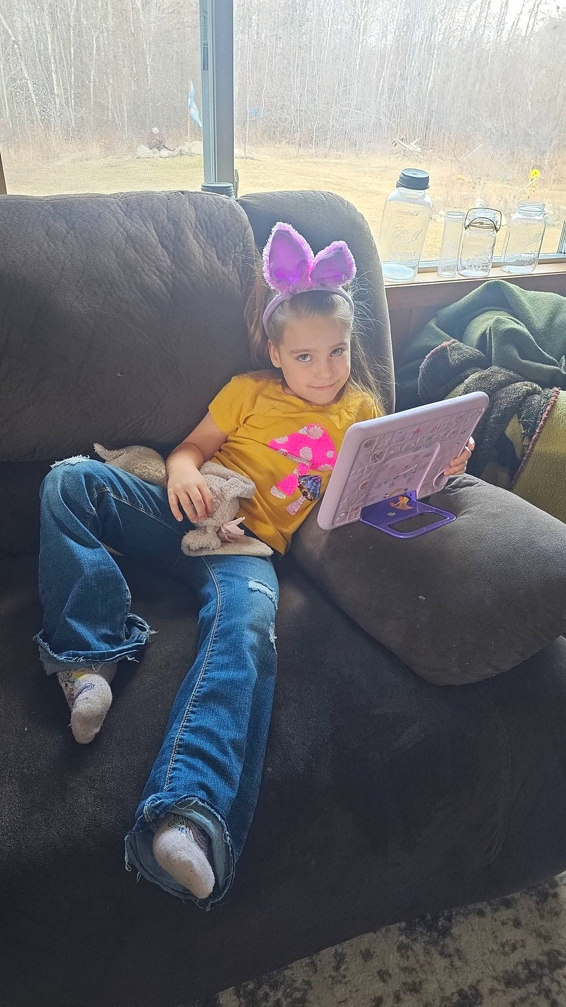 Tilliemay joined the competition — help win amazing prizes! child, comfort, cool, couch, denim, electronic_device, eyewear, flooring, fun, hairstyle, happy, jeans, joy, lap, leg, leisure, person, plant, shoe, sitting