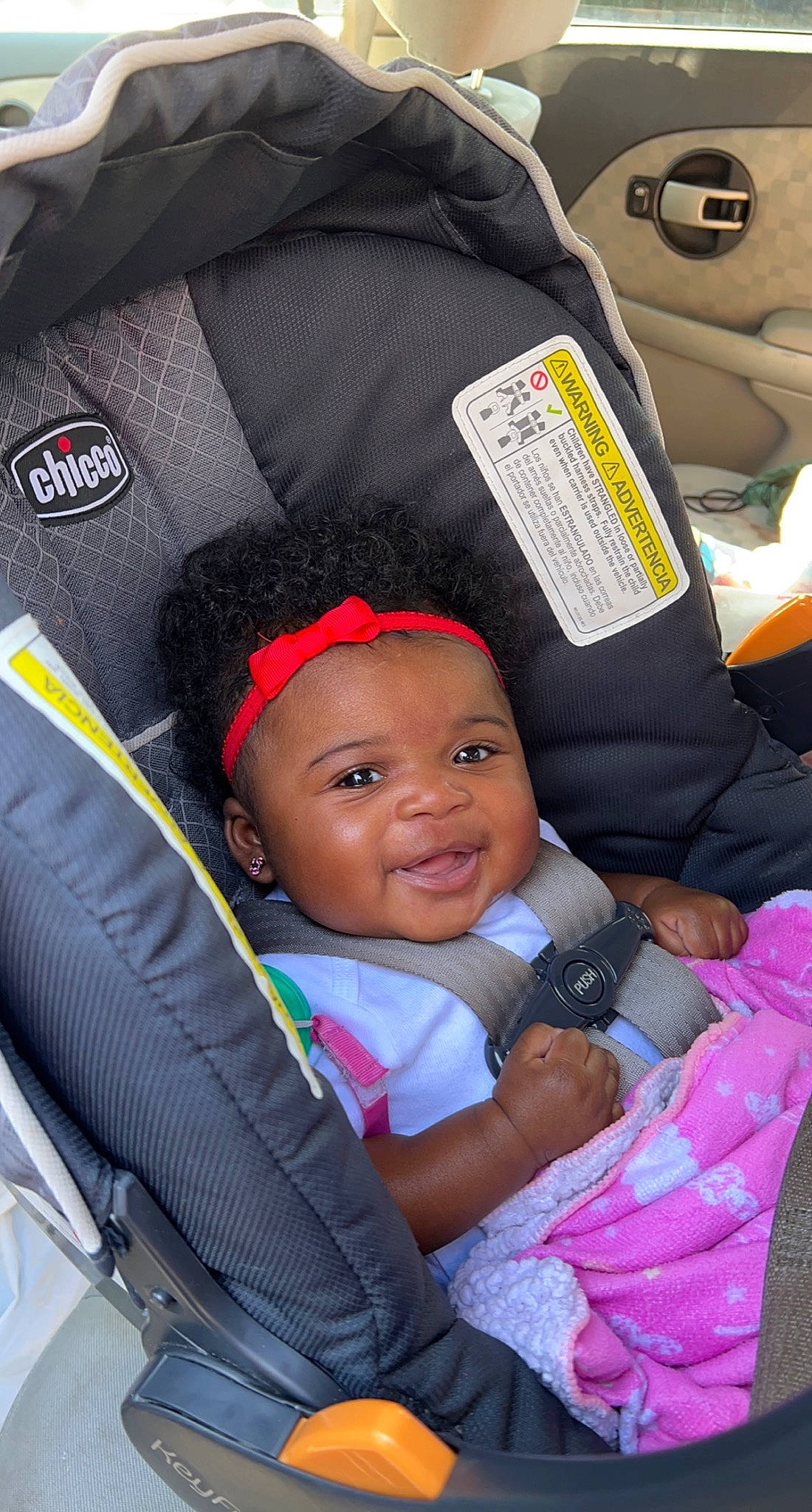 Ariella joined the competition — help win amazing prizes! auto_part, automotive_design, baby, baby_carriage, baby_products, baby_toddler_clothing, black, car_seat, car_seat_cover, child, comfort, fun, happy, head_restraint, motor_vehicle, person, product, red, smile, toddler