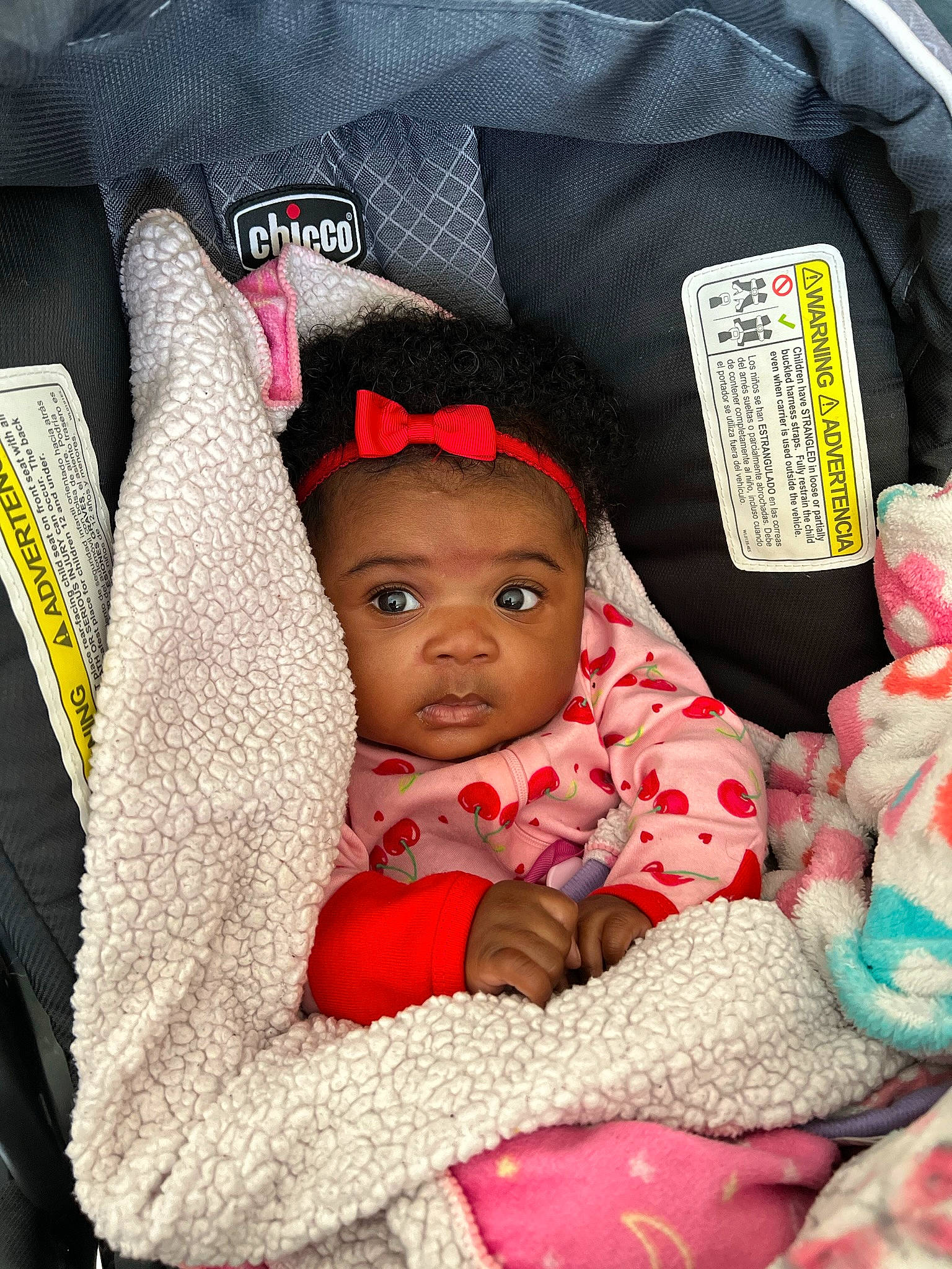 Ariella is registered to the contest to win money with this photo: baby, baby_carriage, baby_products, baby_sleeping, baby_toddler_clothing, cap, car_seat, carmine, cheek, child, comfort, happy, headgear, knit_cap, linens, person, pink, sitting, textile, toddler