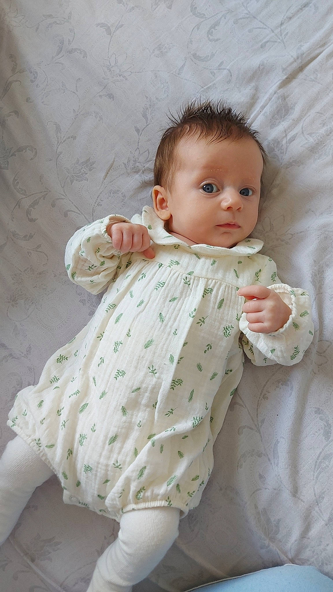 Beau is registered to the contest to win money with this photo: baby, baby_products, baby_toddler_clothing, cheek, child, chin, collar, comfort, face, gesture, linens, lip, one_piece_garment, pattern, person, pink, product, skin, sleeve, textile