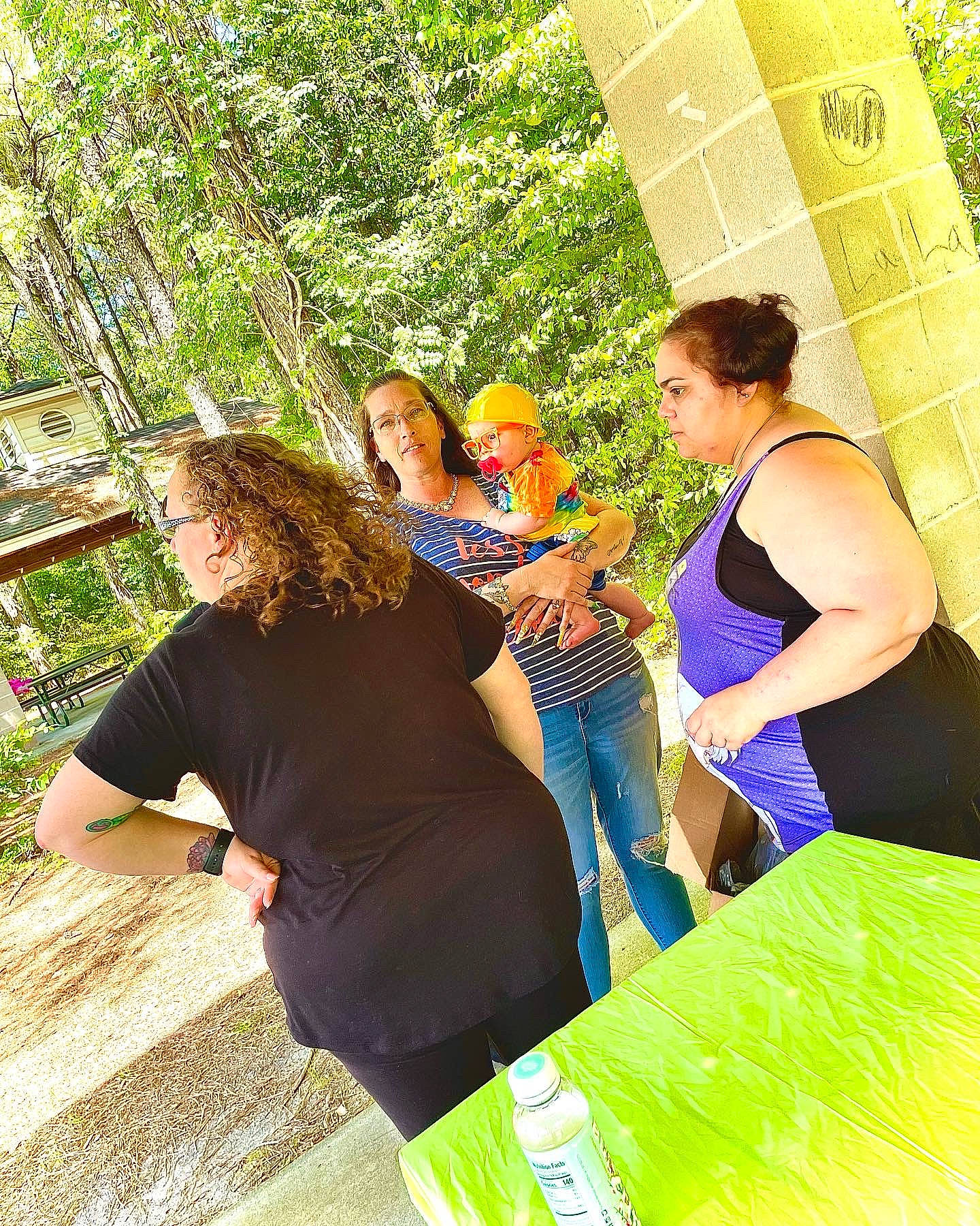 Mark is registered to the contest to win money with this photo: bag, event, fun, grass, happy, leisure, luggage_and_bags, people_in_nature, person, plant, recreation, sitting, spring, t_shirt, thigh, tourism, travel, tree, waist, woody_plant