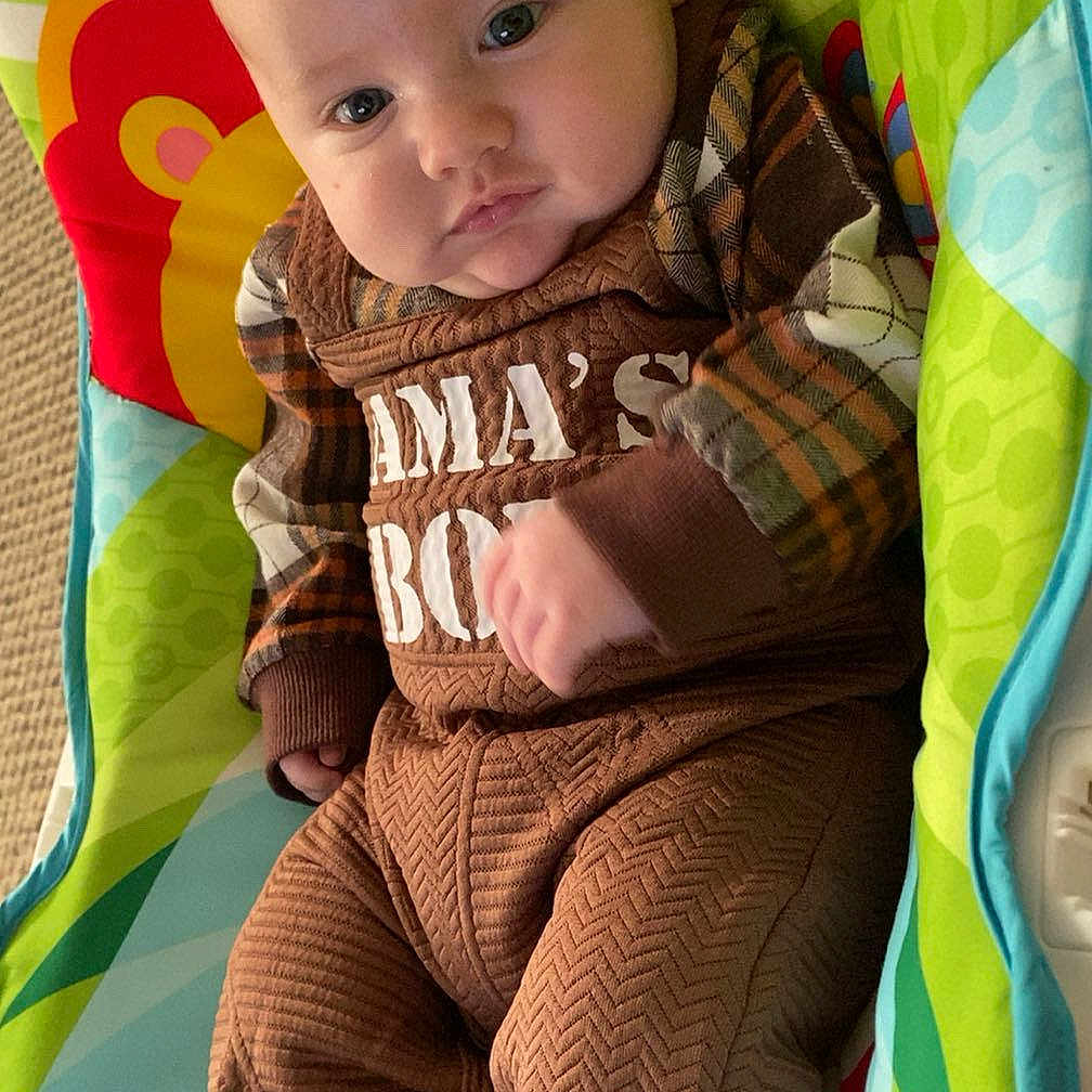 Kaytum joined the competition — help win amazing prizes! baby, blanket, clothing, coat, cushion, face, furniture, happy, head, homedecor, jacket, knitwear, pants, person, photography, portrait, quilt, sitting, smile, sweater