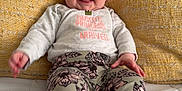 Beverly is registered to the contest to win money with this photo: baby, bed, child, clothing, cute, face, foot, hand, happy, indoors, infant, pants, person, pillow, portrait, shirt, sitting, smile, white, yellow