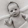 baby, newborn, infant, black_and_white, portrait, closeup, soft_texture, knitted_cloth, curious_eyes, tiny_fingers, blanket, skin, lying_down, cute, peaceful, child, monochrome, small_hands, face, expression