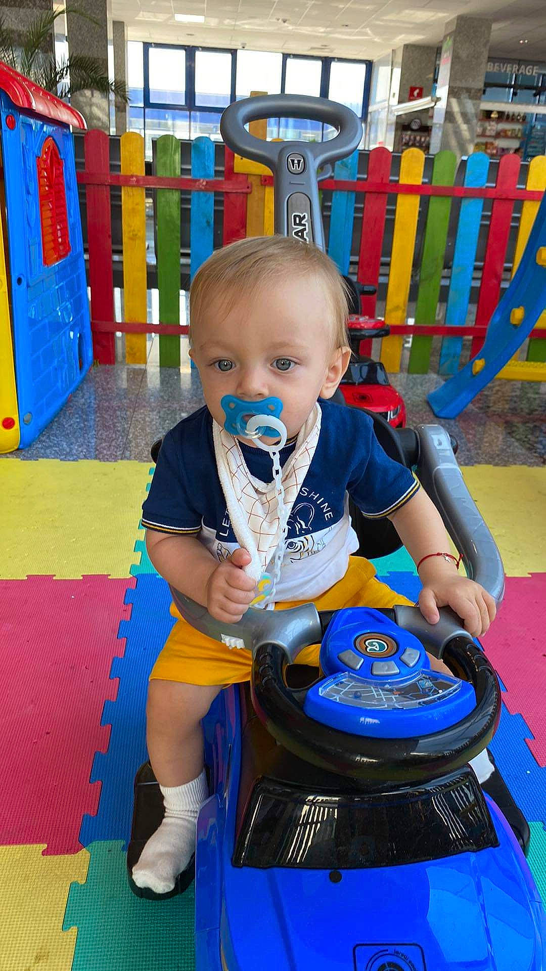 Mathias participe au concours pour gagner de l'argent avec cette photo : baby, baby_playing_with_toys, baby_products, baby_toddler_clothing, baby_toys, blue, child, electric_blue, fun, leisure, outdoor_play_equipment, person, play, playground, product, recreation, room, sitting, toddler, toy_vehicle