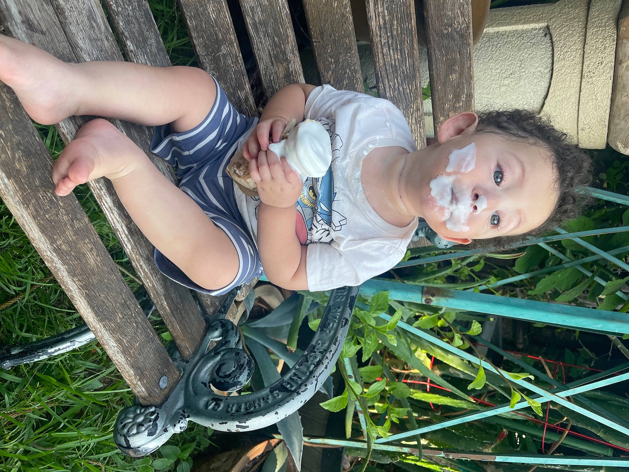 Maximiliano is registered to the contest to win money with this photo: baby, baby_toddler_clothing, dress, foot, fun, grass, grass_family, human_leg, leg, leisure, organ, people_in_nature, person, plant, sandal, sitting, skin, spring, surprise, thigh