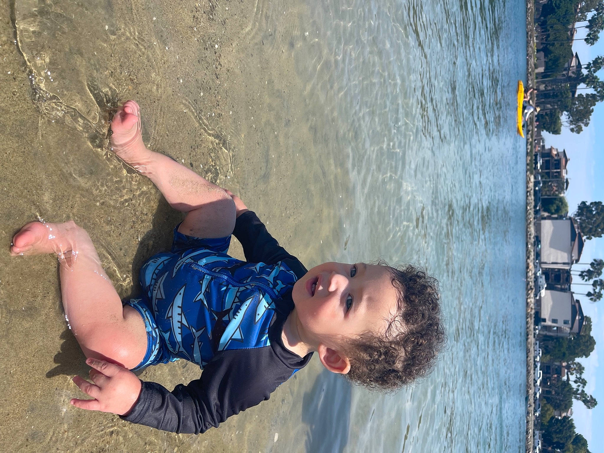 Maximiliano joined the competition — help win amazing prizes! barefoot, boats_and_boating_equipment_and_supplies, child, electric_blue, facial_expression, fun, happy, lake, leg, leisure, light, people_in_nature, person, recreation, reflection, sky, smile, toddler, travel, tree