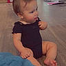 Jaylani joined the competition — help win amazing prizes! appliance, baby, black_clothing, blanket, child, curious, face, feet, floor, hand, home, indoor, kitchen, onesie, person, pink_paper, sitting, toddler, trash_can, wooden_floor
