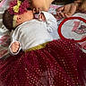Jaylani joined the competition — help win amazing prizes! affection, baby, blanket, carpet, child, clothing, cute, face, family, footwear, hand, headband, indoors, kiss, love, lying_down, person, sibling, toddler, tutu