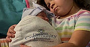 Jaylani joined the competition — help win amazing prizes! affection, baby, blanket, care, child, comfort, couch, cute, family, holding, hospital, indoor, love, newborn, pillow, portrait, seated, sibling, striped_shirt, toddler