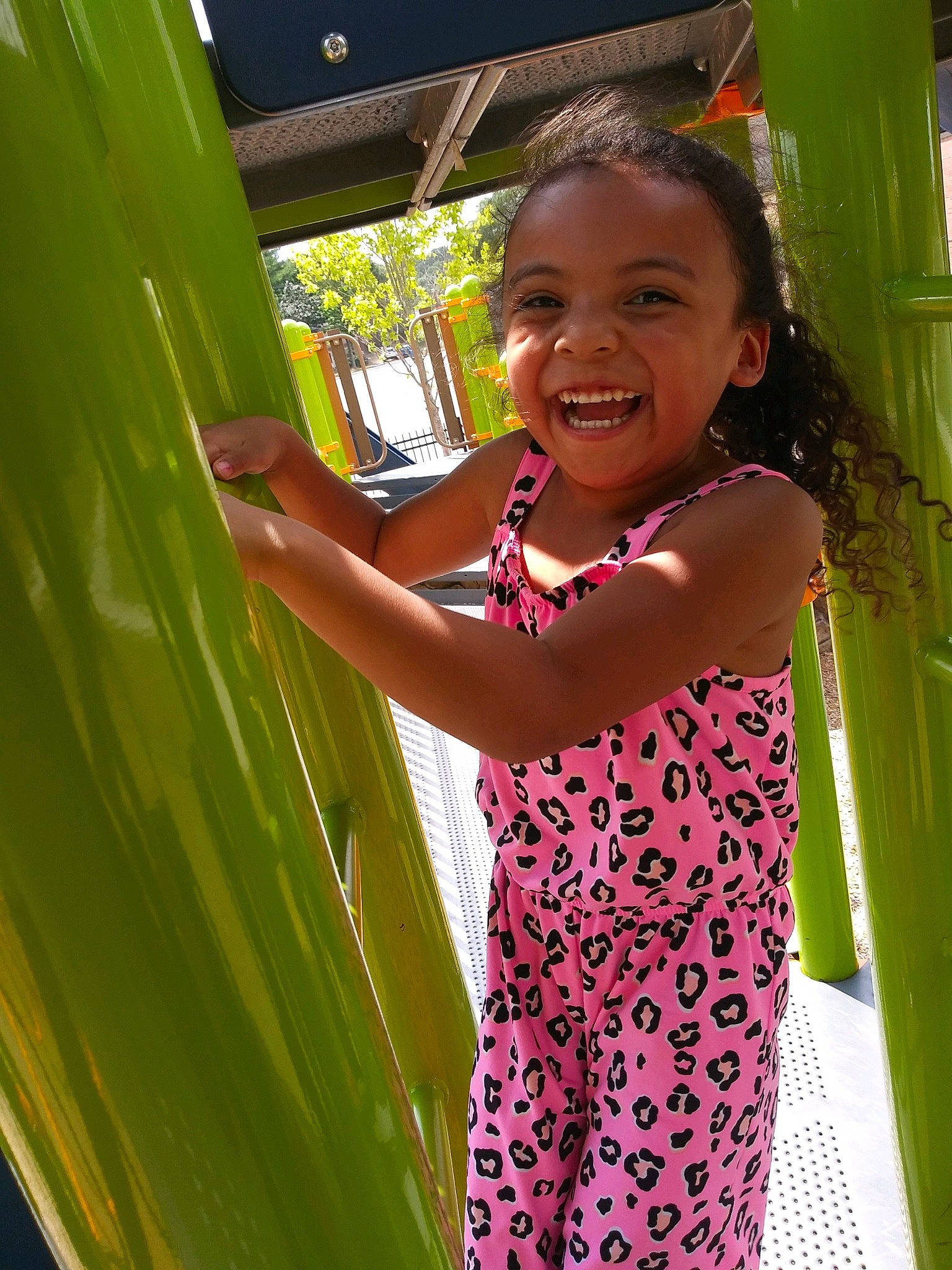 Kaylana is registered to the contest to win money with this photo: black_hair, child, fun, grass, happy, human_body, joy, laugh, leisure, magenta, pattern, person, pink, play, recreation, skin, smile, standing, summer, t_shirt