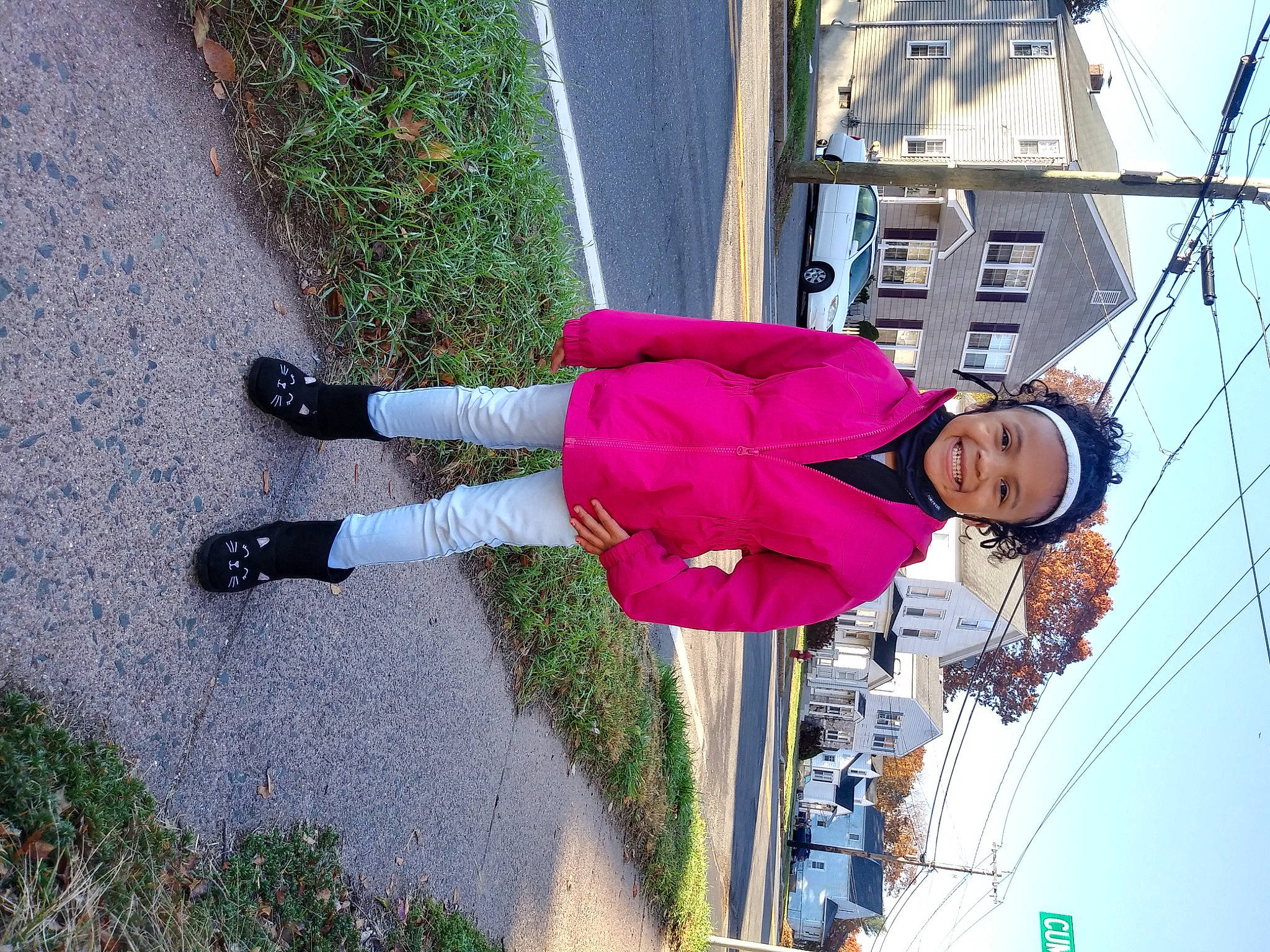 Kaylana is registered to the contest to win money with this photo: asphalt, carmine, electric_blue, electricity, fun, grass, headwear, joy, leisure, overhead_power_line, pedestrian, person, plant, public_utility, recreation, road_surface, sidewalk, sky, smile, travel