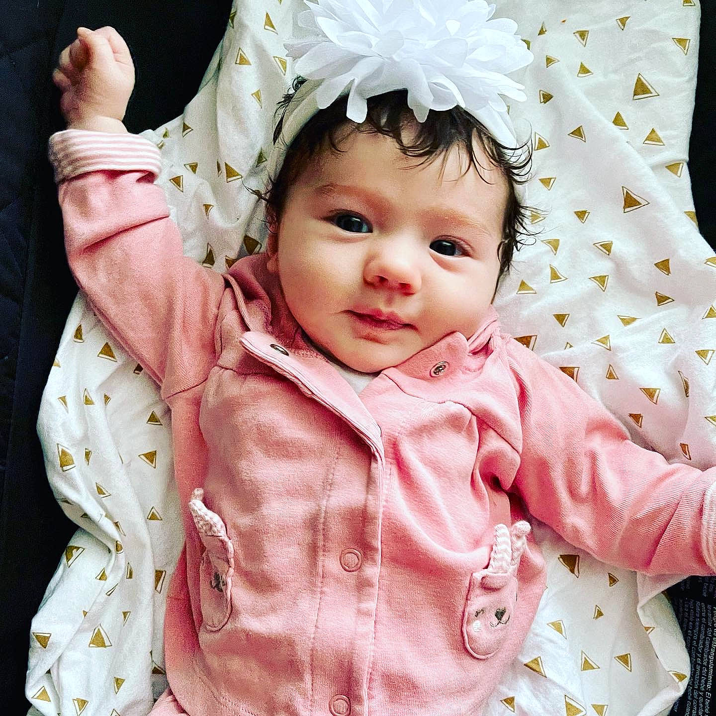 Haislee is registered to the contest to win money with this photo: baby, baby_toddler_clothing, cheek, child, collar, facial_expression, fashion_accessory, gesture, happy, headwear, linens, outerwear, pattern, person, pink, product, skin, sleeve, smile, textile