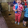 Stella joined the competition — help win amazing prizes! toddler, child, bubble_blower, bubbles, indoor, living_room, pink_sweater, patterned_clothing, happy, playing, floor, furniture, couch, carpet, toy, smiling, person, pants, sock, footwear