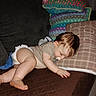 baby, diaper, couch, pillow, sleeping, indoor, child, rest, plaid, fabric, foot, hand, hair, face, blanket, cozy, furniture, curtain, carpet, relaxation