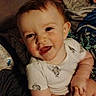 Brandon is registered to the contest to win money with this photo: baby, infant, smiling, happy, face, child, clothing, onesie, skin, head, hair, sitting, blanket, fabric, indoor, cute, portrait, expression, hand, young