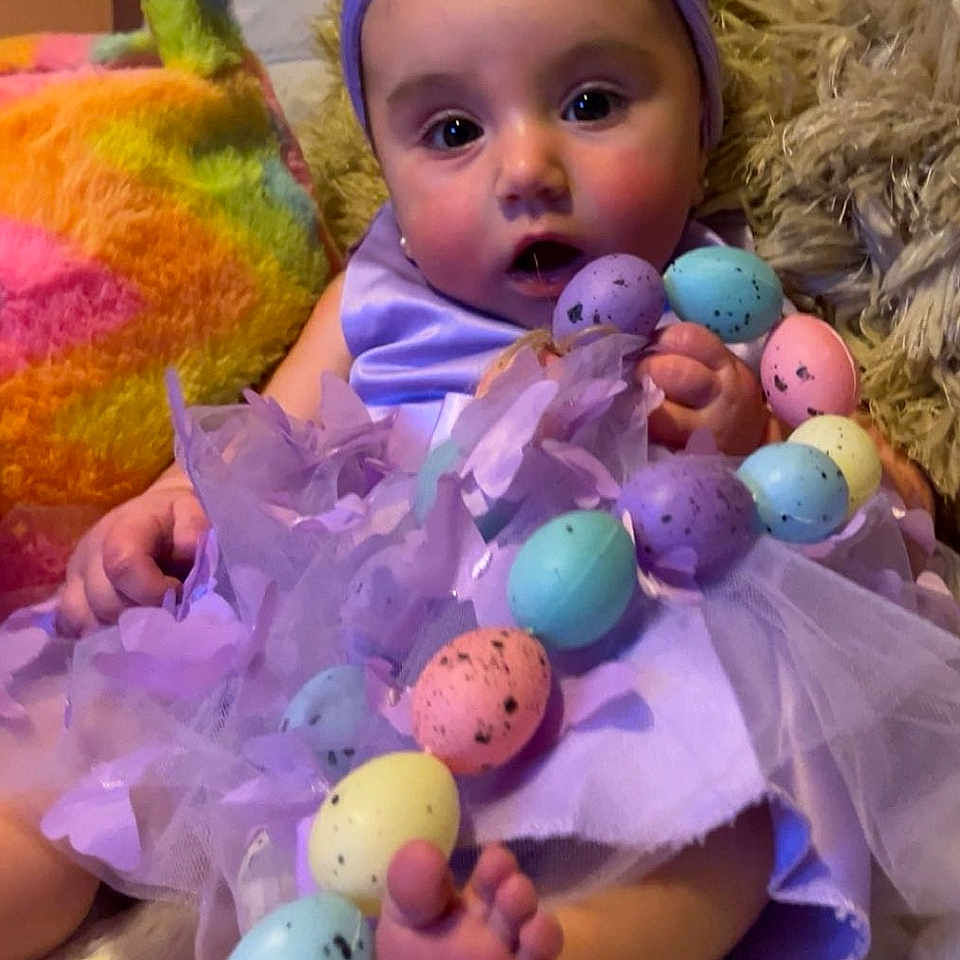 Isabella joined the competition — help win amazing prizes! animal, baby, bird, bodypart, clothing, costume, egg, face, finger, food, hand, hat, head, people, person, photography, portrait, purple, sweets, toy