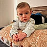 Bryson joined the competition — help win amazing prizes! baby, infant, child, face, hands, pillow, pattern, bedroom, furniture, blanket, clothing, sleeves, expression, curious, indoor, person, portrait, soft_lighting, young, cozy