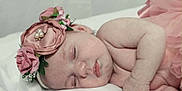 Kinsley is registered to the contest to win money with this photo: baby, sleeping, flower_headband, pink_tutu, soft_blanket, newborn, peaceful, cute, infant, portrait, skin, hand, face, closed_eyes, resting, adorable, child, tender, lying_down, soft_lighting