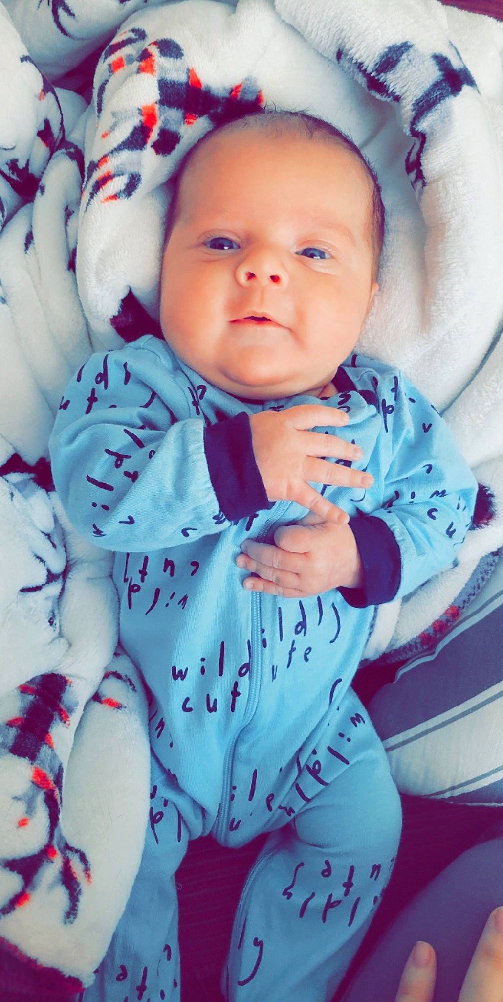 Waylon is registered to the contest to win money with this photo: baby, baby_products, baby_toddler_clothing, cheek, child, collar, comfort, electric_blue, eye, fun, happy, iris, linens, pattern, person, sitting, sleeve, smile, thumb, toddler